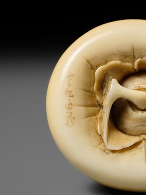 UNSHO HAKURYU: A FINE IVORY NETSUKE OF A PERSIMMON WITH INLAID SNAIL