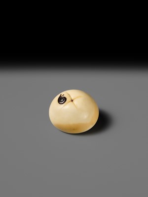 UNSHO HAKURYU: A FINE IVORY NETSUKE OF A PERSIMMON WITH INLAID SNAIL