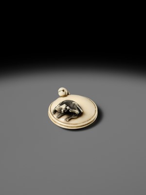 MITSUHARU: AN IVORY NETSUKE OF A DOG ON A CUSHION