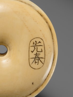 MITSUHARU: AN IVORY NETSUKE OF A DOG ON A CUSHION