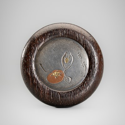 Lot 629 - SESSAI: A WOOD KAGAMIBUTA NETSUKE WITH PERSIMMON