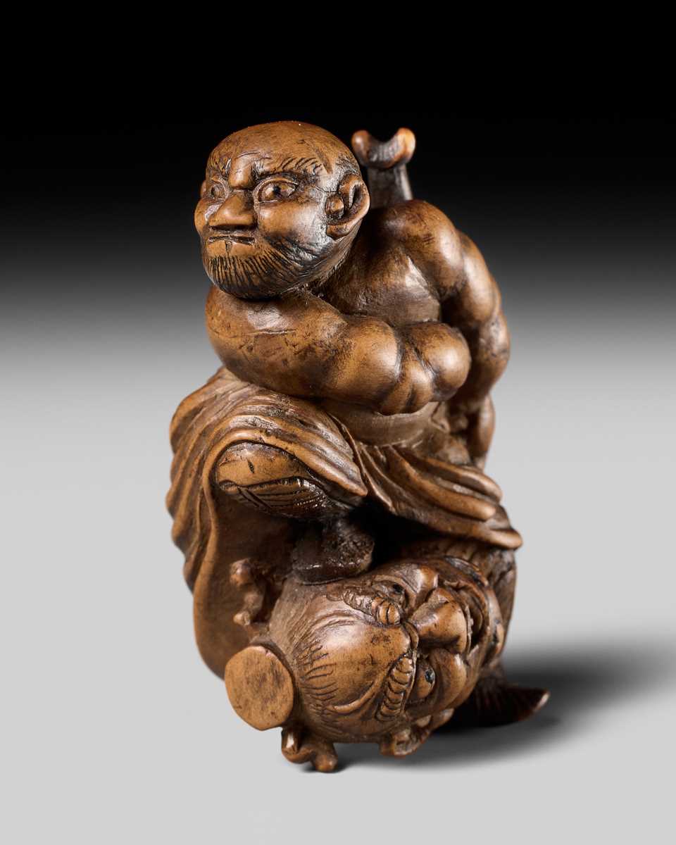 Lot 133 - A RARE WOOD NETSUKE OF ROCHISHIN