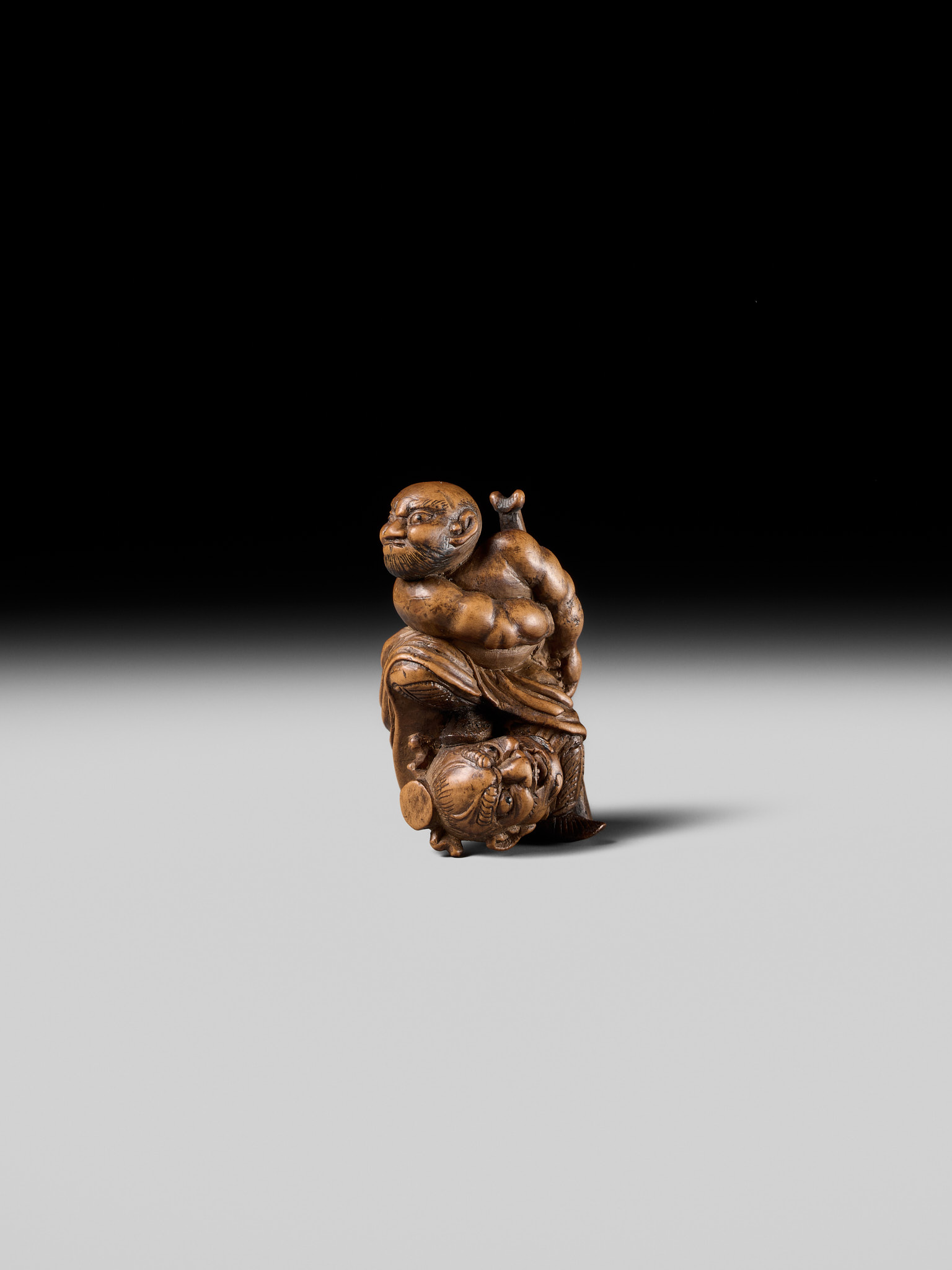 Lot 133 - A RARE WOOD NETSUKE OF ROCHISHIN