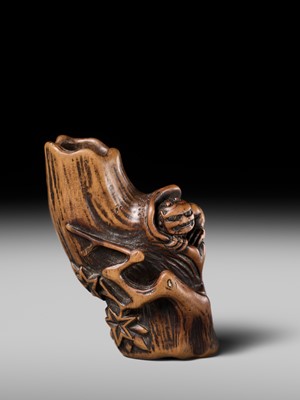 Lot 134 - MASAKAZU: A RARE WOOD NETSUKE OF AN ONI HIDING IN A TREE STUMP