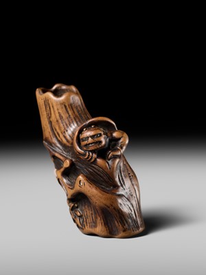 Lot 134 - MASAKAZU: A RARE WOOD NETSUKE OF AN ONI HIDING IN A TREE STUMP