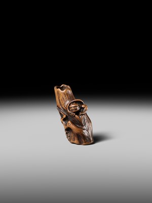 Lot 134 - MASAKAZU: A RARE WOOD NETSUKE OF AN ONI HIDING IN A TREE STUMP