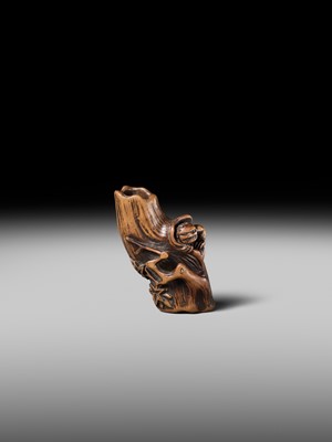 Lot 134 - MASAKAZU: A RARE WOOD NETSUKE OF AN ONI HIDING IN A TREE STUMP