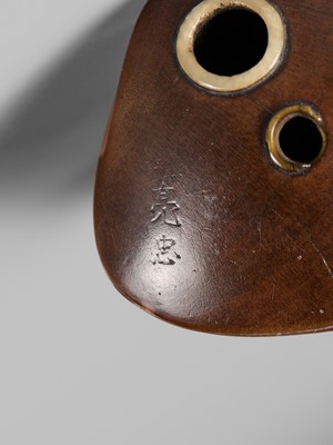 Lot 402 - SUKETADA: A FINE WOOD NETSUKE OF A KAPPA ON HAMAGURI CLAM