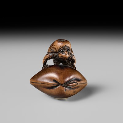 Lot 402 - SUKETADA: A FINE WOOD NETSUKE OF A KAPPA ON HAMAGURI CLAM