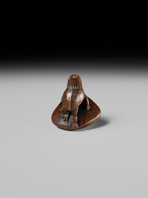 Lot 402 - SUKETADA: A FINE WOOD NETSUKE OF A KAPPA ON HAMAGURI CLAM