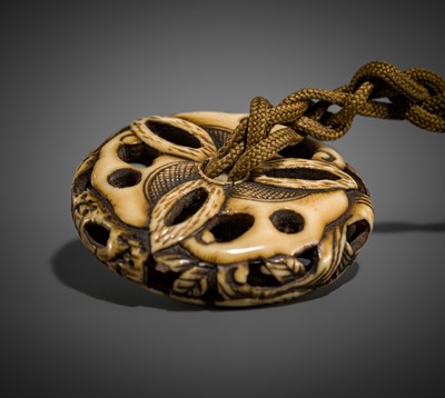 Lot 471 - A FINE ANTLER RYUSA MANJU NETSUKE DEPICTING A HAGOROMO AND PINES