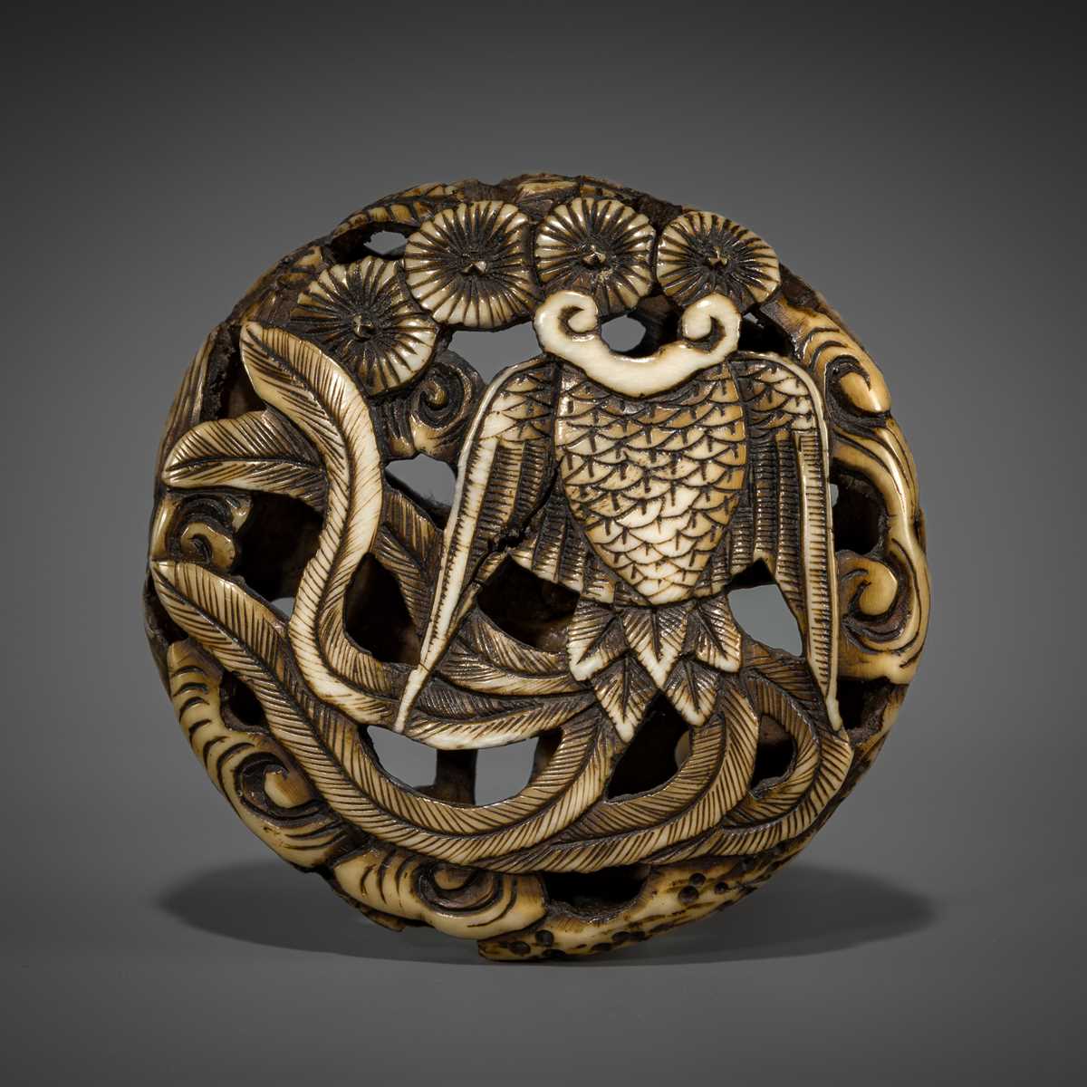Lot 471 - A FINE ANTLER RYUSA MANJU NETSUKE DEPICTING A HAGOROMO AND PINES