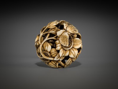 Lot 473 - A FINE WALRUS TUSK RYUSA MANJU NETSUKE OF BUTTERFLIES AND SUNFLOWERS