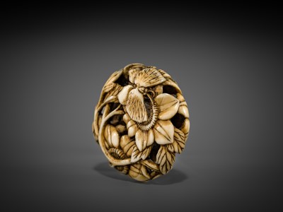 Lot 473 - A FINE WALRUS TUSK RYUSA MANJU NETSUKE OF BUTTERFLIES AND SUNFLOWERS