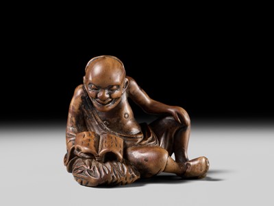 Lot 121 - A WOOD NETSUKE OF RIHAKU