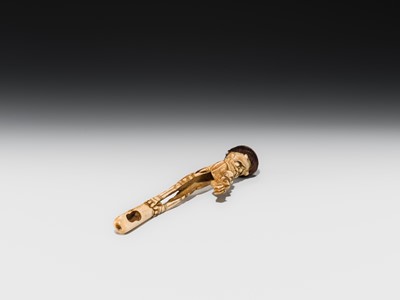 Lot 76 - AN ANTLER KISERUZUTSU (PIPE CASE) OF AN ONI WITH AN OKAME MASK
