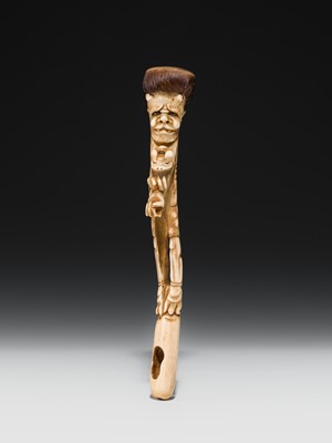 Lot 76 - AN ANTLER KISERUZUTSU (PIPE CASE) OF AN ONI WITH AN OKAME MASK