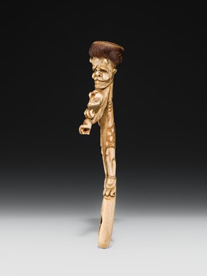 Lot 76 - AN ANTLER KISERUZUTSU (PIPE CASE) OF AN ONI WITH AN OKAME MASK
