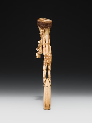 Lot 76 - AN ANTLER KISERUZUTSU (PIPE CASE) OF AN ONI WITH AN OKAME MASK