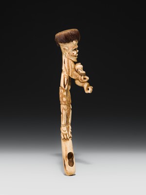 Lot 76 - AN ANTLER KISERUZUTSU (PIPE CASE) OF AN ONI WITH AN OKAME MASK