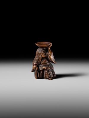 Lot 175 - HIDEHARU: A NAGOYA SCHOOL WOOD NETSUKE OF A DRUNKEN SHOJO BALANCING A SAKE SAUCER