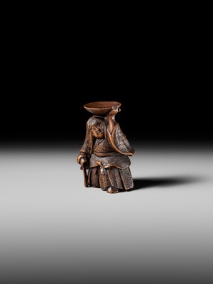 Lot 175 - HIDEHARU: A NAGOYA SCHOOL WOOD NETSUKE OF A DRUNKEN SHOJO BALANCING A SAKE SAUCER