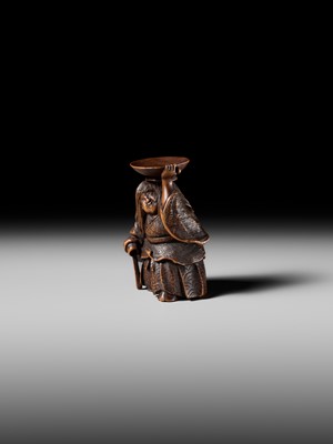 Lot 175 - HIDEHARU: A NAGOYA SCHOOL WOOD NETSUKE OF A DRUNKEN SHOJO BALANCING A SAKE SAUCER