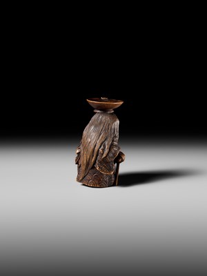 Lot 175 - HIDEHARU: A NAGOYA SCHOOL WOOD NETSUKE OF A DRUNKEN SHOJO BALANCING A SAKE SAUCER
