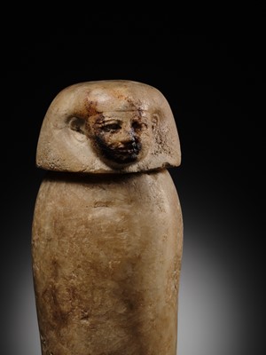 Lot 31 - AN ALABASTER ‘IMSETY’ CANOPIC JAR AND LID, LATE PERIOD