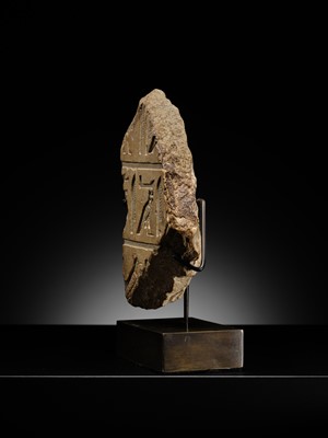 Lot 23 - A LIMESTONE RELIEF FRAGMENT WITH HIEROGLYPHIC INSCRIPTION, OLD KINGDOM OR ARCHAIZING LATE PERIOD