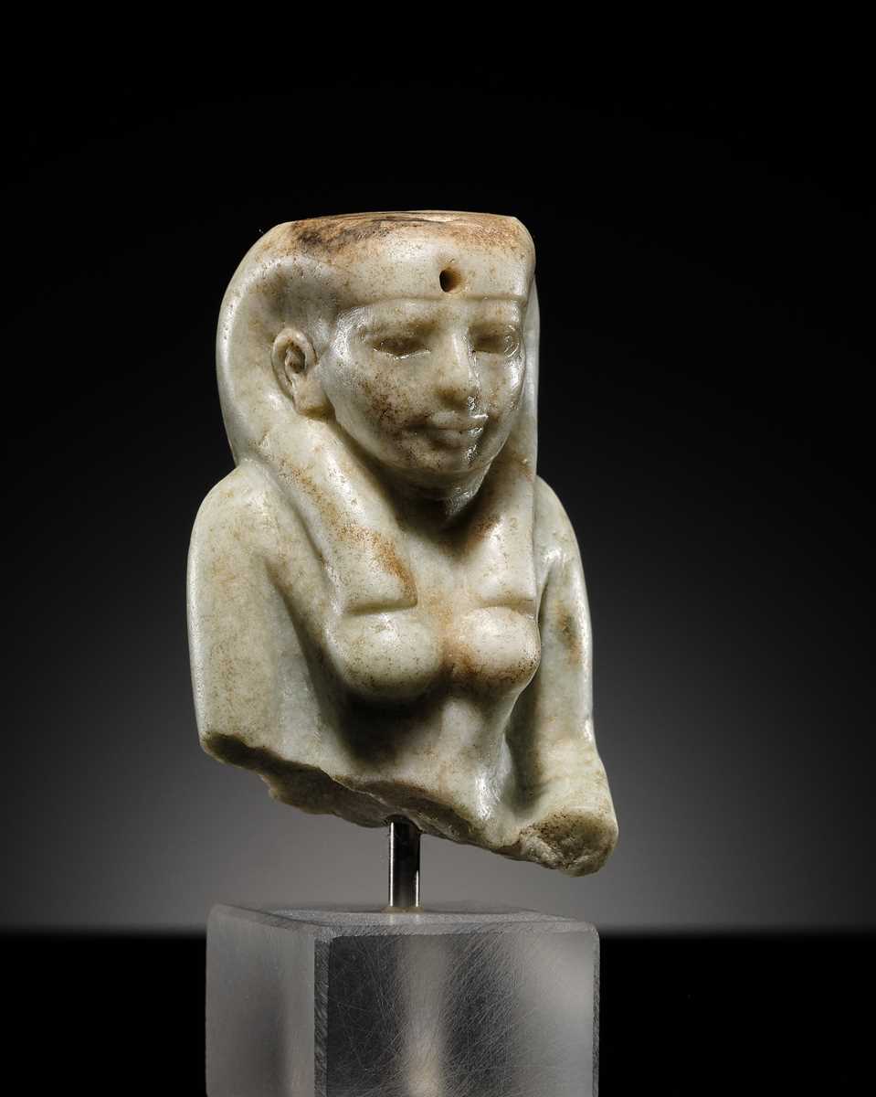Lot 11 - AN OPHICALCITE BUST OF A FEMALE DEITY, PROBABLY ISIS, LATE PERIOD, DYNASTY XXV–XXVI
