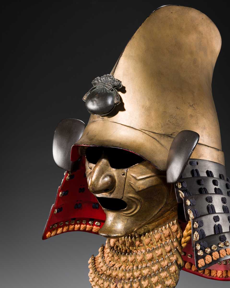 Lot 100 - A GOLD-LACQUERED IRON EBOSHI-NARI KABUTO AND RESSEI MENPO