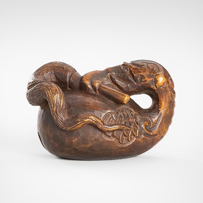 Lot 1585 - A RARE WOOD NETSUKE OF A MOKUGYO WITH HOSSU