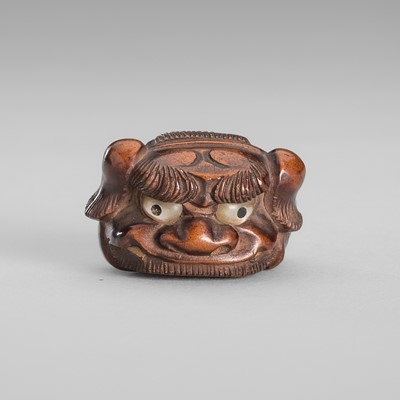Lot 1586 - A SIGNED AND INLAID WOOD NETSUKE OF A SHISHIMAI BOY