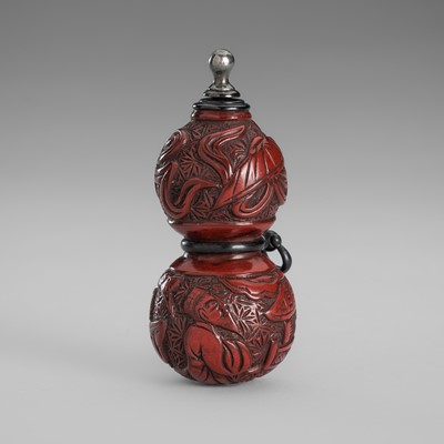Lot 1750 - A TSUISHU LACQUER HYOTAN-FORM NETSUKE