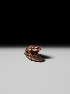 Lot 391 - MASATADA: A FINE WOOD NETSUKE OF A TOAD ON A WARAJI