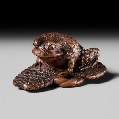 Lot 391 - MASATADA: A FINE WOOD NETSUKE OF A TOAD ON A WARAJI