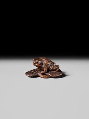 Lot 391 - MASATADA: A FINE WOOD NETSUKE OF A TOAD ON A WARAJI