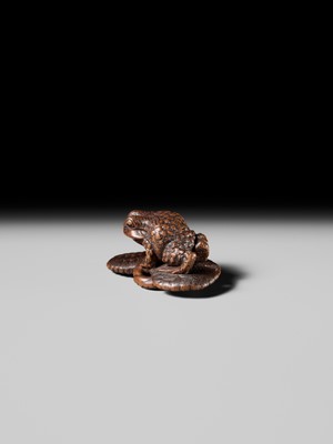 Lot 391 - MASATADA: A FINE WOOD NETSUKE OF A TOAD ON A WARAJI