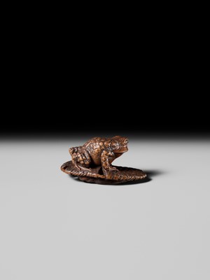 Lot 391 - MASATADA: A FINE WOOD NETSUKE OF A TOAD ON A WARAJI