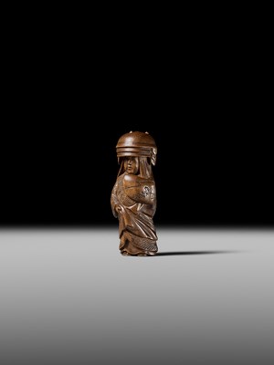 Lot 255 - HOJITSU: A FINE WOOD NETSUKE OF NABE KABURI