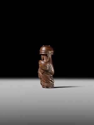 Lot 255 - HOJITSU: A FINE WOOD NETSUKE OF NABE KABURI