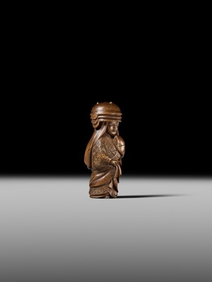 Lot 255 - HOJITSU: A FINE WOOD NETSUKE OF NABE KABURI