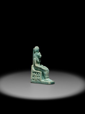A LARGE TURQUOISE-GLAZED FAIENCE AMULET OF THE ENTHRONED SEKHMET, LATE PERIOD