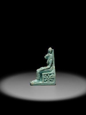 A LARGE TURQUOISE-GLAZED FAIENCE AMULET OF THE ENTHRONED SEKHMET, LATE PERIOD