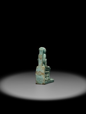 A LARGE TURQUOISE-GLAZED FAIENCE AMULET OF THE ENTHRONED SEKHMET, LATE PERIOD