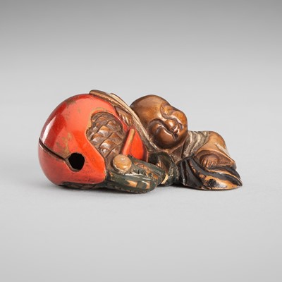 Lot 1744 - NISAI: A FINE LACQUER NETSUKE OF A MONK RESTING ON A MOKUGYO BELL