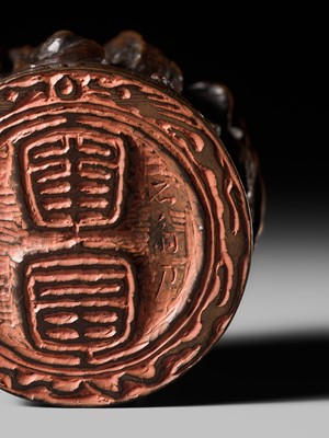 Lot 177 - A FINE OPENWORK WOOD INSHO (SEAL-TYPE) NETSUKE WITH DRAGONS