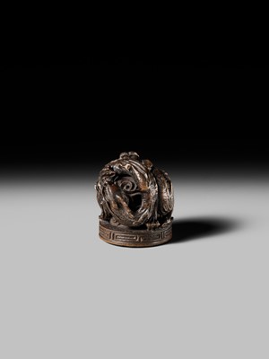 Lot 177 - A FINE OPENWORK WOOD INSHO (SEAL-TYPE) NETSUKE WITH DRAGONS