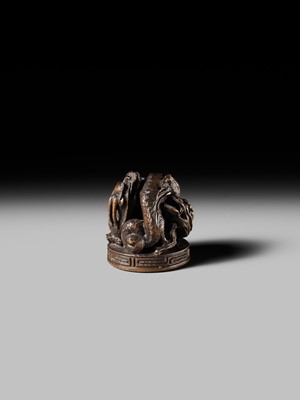 Lot 177 - A FINE OPENWORK WOOD INSHO (SEAL-TYPE) NETSUKE WITH DRAGONS